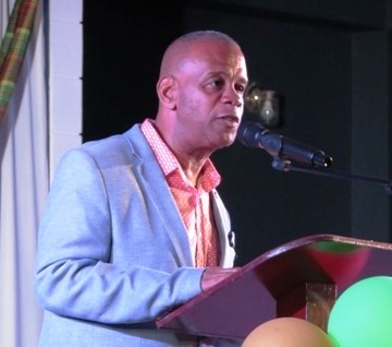 Hon. Eric Evelyn, Minister of Social Development and Culture delivering remarks at the official opening and naming of the first multi-purpose facility in Gingerland on November 28, 2019