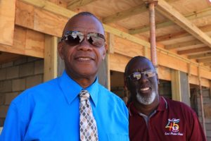 (L-r) Hon. Eric Evelyn, Minister of Social Development and Culture on Nevis and Mr. Antonio “Abonaty” Liburd, Project Manager for the construction of the multi-purpose facility project at Market Shop in Gingerland, on site at the project on October 30, 2019