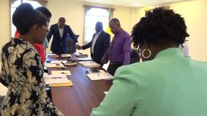 Members of the Nevis Island Administration Cabinet led by Hon. Mark Brantley, Premier of Nevis, in prayer with Rev. Marcia Tomlinson during the first meeting of Cabinet for the year on January 08, 2020