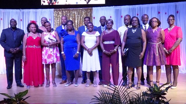 Some of the 16 retirees honoured by the Ministry of Education with Hon. Mark Brantley, Premier of Nevis and Minister of Education (back row - third from left); Hon. Troy Liburd, Junior Minister of Education (back row - fourth from left); Mr. Kevin Barrett, Permanent Secretary in the Ministry of Education (back row – extreme right); Ms. Zhanela Claxton, Principal Education Officer (back row – second from left) and Hon. Alexis Jeffers (back row - extreme left), at the Retirement Awards Ceremony and Cocktail hosted by the Ministry of Education, Library Services and Information Technology at the Nevis Performing Arts Centre at Pinney’s estate on February 08, 2020