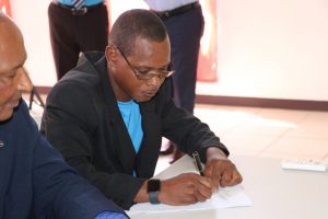 Mr. Denzil Webbe of Cotton Ground signs the Statutory Declaration of a Person Nominating a Candidate for Election as a Member of the Nevis Island Assembly on Nomination Day, February 25, 2020, for Mr. Keith “Dis an Dat” Scarborough of Cotton Ground, the representative for the Concerned Citizens Movement, in the March 05, 2020, by-election in District 5, St. Thomas’ Parish (Lowlands)