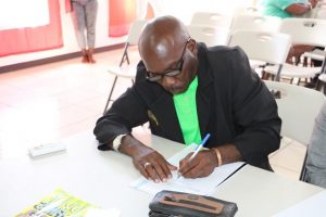 Mr. Collin Terrence Stapleton of Cotton Ground signs the Statutory Declaration of a Person Nominating a Candidate for Election as a Member of the Nevis Island Assembly on Nomination Day, February 25, 2020, for Mrs. Cleone Stapleton Simmonds of Cotton Ground, the representative for the Nevis Reformation Party, in the March 05, 2020, by-election in District 5, St. Thomas’ Parish (Lowlands)