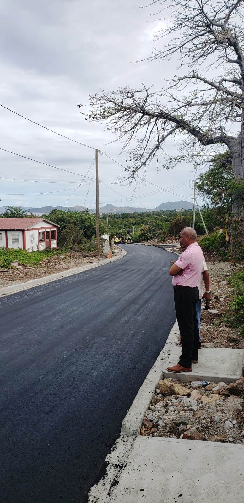 Hon Spencer Brand, Minister of Communication and Work, visits the Craddock Road Rehabilitation Project from Big Rock to the Social Security road junction during the asphalting phase on March 13, 2020