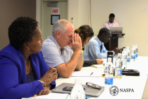 Mr. Micahail Manners, Operations Manager at the Vance W. Amory International Airport addressing participants including Dr. Judy Nisbett, Medical Officer of Health (l) Mrs. Nadine Carty-Caines Programme Coordinator at the Health Promotion Unit (second from right) at the Rapid Response COVID-19 meeting hosted by the Nevis Air and Sea Ports Authority at the Nevis Disaster Management Department’s Emergency Operation Centre on March 16, 2020 