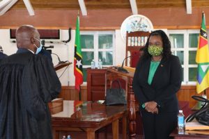 Hon. Farrel Smithen, President of the Nevis Island Assembly, congratulates Hon. Cleone Stapleton Simmonds after she was sworn in as a member of the Assembly at an emergency sitting on April 18, 2020