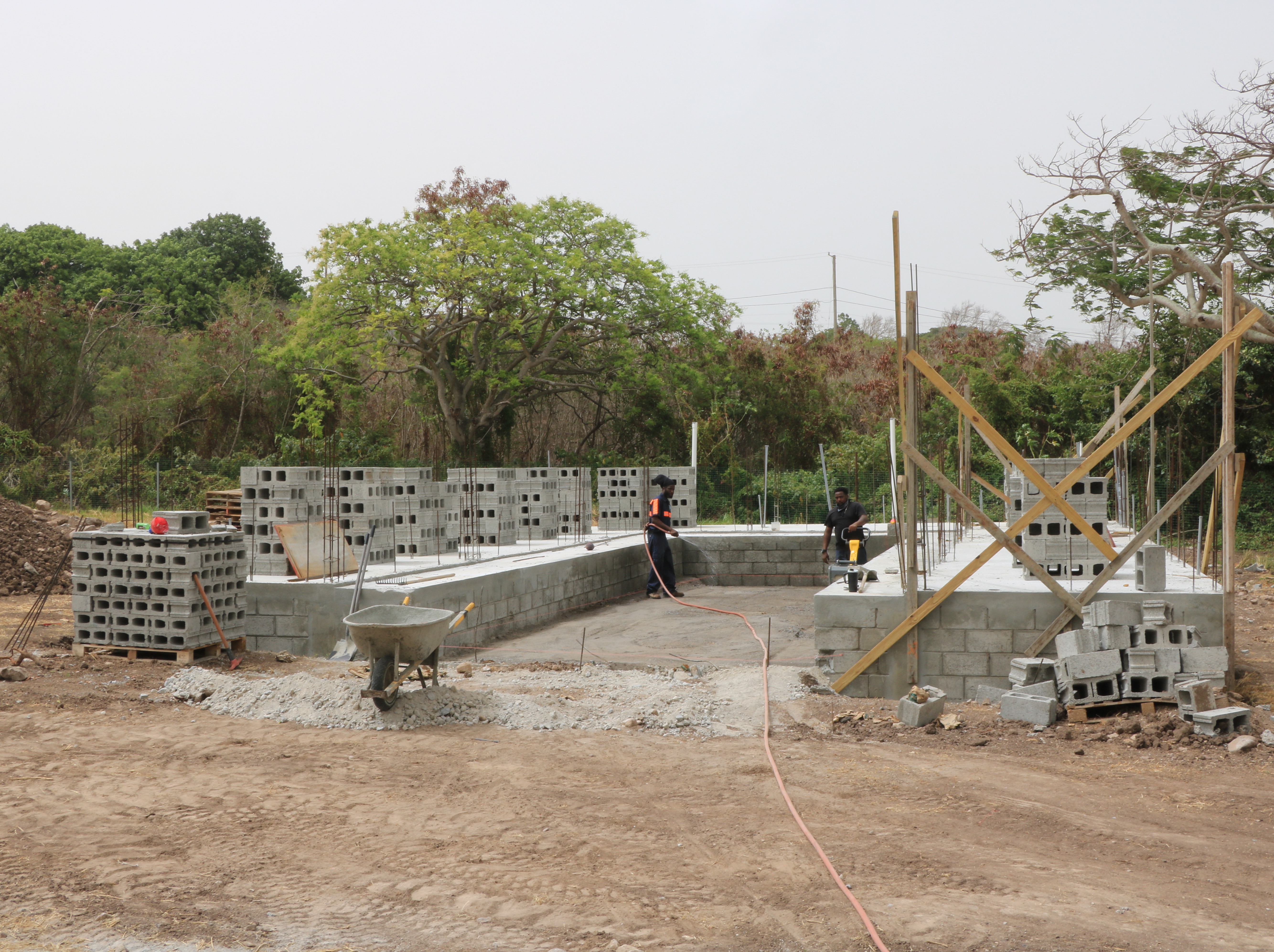 Members of the Building Division in the Public Works Department working on constructing a cold storage facility on the government-owned farm at Prospect on June 22, 2020