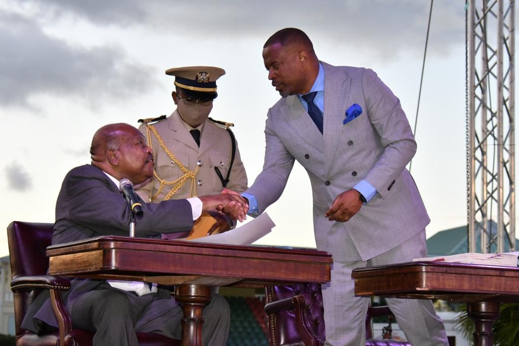 Hon. Mark Brantley, Premier of Nevis receives his instruments as Minister of Foreign Affairs and Civil Aviation in the Federal Cabinet from His Excellency Sir Tapley Seaton, Governor General of St. Kitts and Nevis at the Inauguration Ceremony of the Team Unity Administration’s Second Term at Warner Park in Basseterre on June 14, 2020