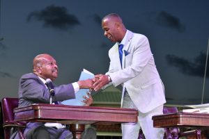 Hon. Eric Evelyn, Senior Minister in the Nevis Island Administration receives his instruments as Minister of Environment and Cooperatives in the Federal Cabinet from His Excellency Sir Tapley Seaton, Governor General of St. Kitts and Nevis at the Inauguration Ceremony of the Team Unity Administration’s Second Term at Warner Park in Basseterre on June 14, 2020