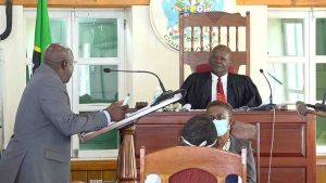 Hon. Alexis Jeffers, Deputy Premier of Nevis and Minister of Agriculture, delivering his presentation before Hon. Farrel Smithen, President of the Nevis Island Assembly while Ms. Myra Williams, Clerk of the Assembly looks during a sitting in Chambers at Hamilton House on July 02, 2020