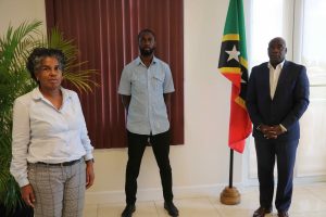 (L-R) Ms. Sharon Jones, Technical Specialist with the Inter-American Institute for Cooperation on Agriculture and Mr. Kistian Flemming, Representative and Climate Change Development Specialist with the Caribbean Agricultural Research Development Institute meeting with Federal Minister of Agriculture and Agriculture Minister in the Nevis Island Administration at his Pinney’s Estate office on June 09, 2020 