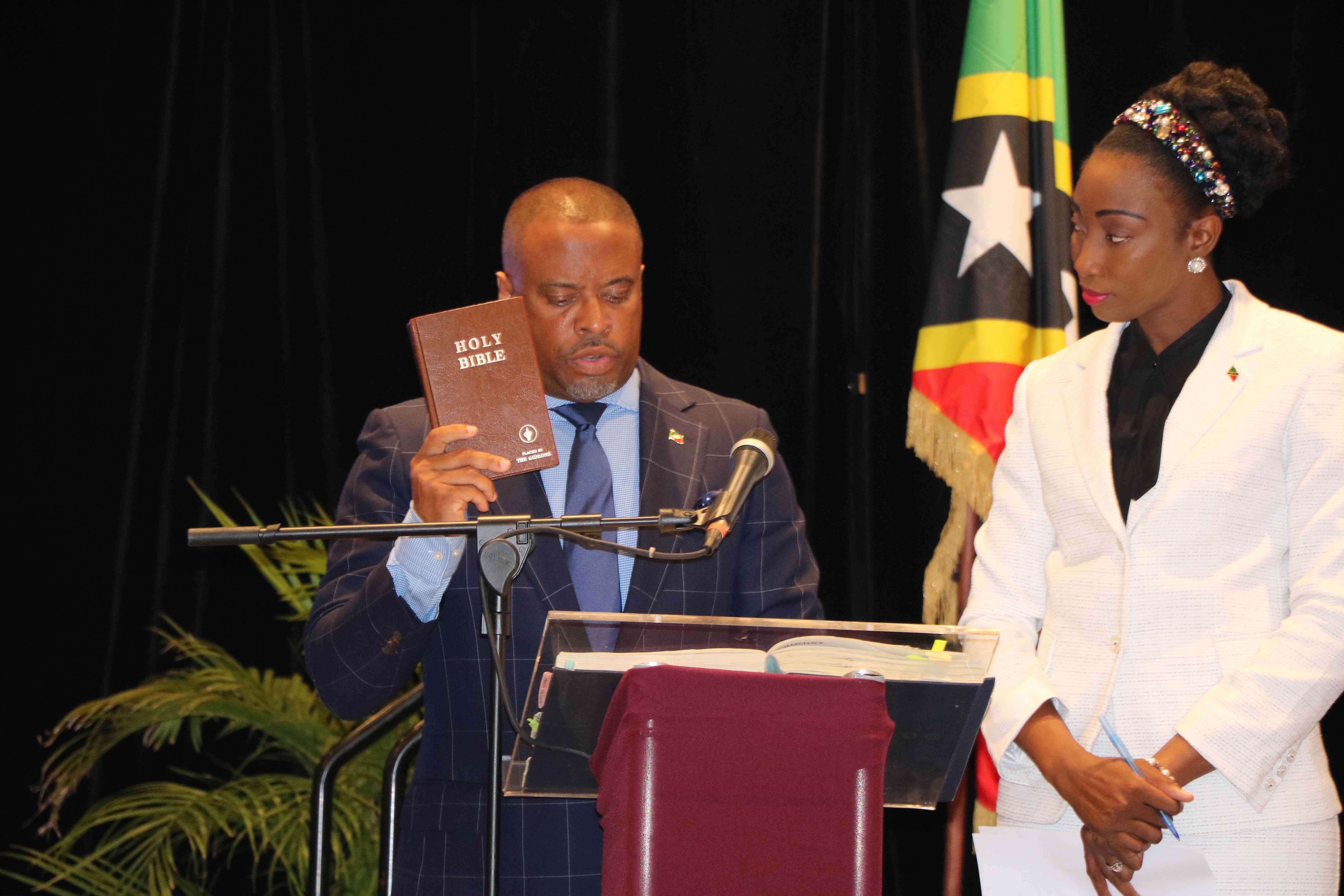 Hon. Mark Brantley, Member for Nevis 9 in the National Assembly, taking the Oath of Allegiance at the Opening of the National Assembly at the St. Kitts Marriott Resort on July 08, 2020, while Mrs. Sonia Boddie-Thompson, Clerk of the National Assembly looks on