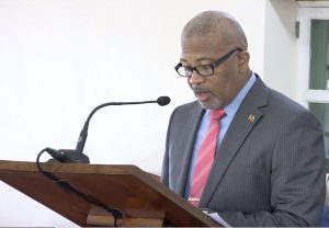 Hon. Spencer Brand, Minister of Communications and Works, making his presentation at a recent sitting of the Nevis Island Assembly in Chambers at Hamilton House in Charlestown