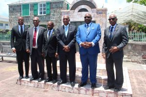 Living prime ministers and premiers in St. Kitts and Nevis on July 31, 2020, standing before the monument erected outside the Nevis Island Assembly Chambers on Samuel Hunkins Drive in memory of those who perished in the MV Christena Disaster on August 01, 1970. (L-r) Hon. Mark. Brantley, Premier of Nevis; Hon. Joseph Parry, former Premier of Nevis; The Right Hon. Denzil Douglas, former Prime Minister of St. Kitts and Nevis; Hon. Vance Amory, former Premier of Nevis; Dr. the Hon. Timothy Harris, Prime Minister of St. Kitts and Nevis; and Dr. the Right Excellency and Right Hon. Sir Kennedy Simmonds, former Prime Minister of St. Kitts and Nevis