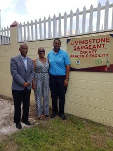 Hon. Eric Evelyn, Minister of Sports, Youth and Community Development in the NIA; with Mildred Sargeant, wife of Livingstone Sargeant; and Tavo Sargeant, son of Livingston Sargeant; at the new cricket practice facility