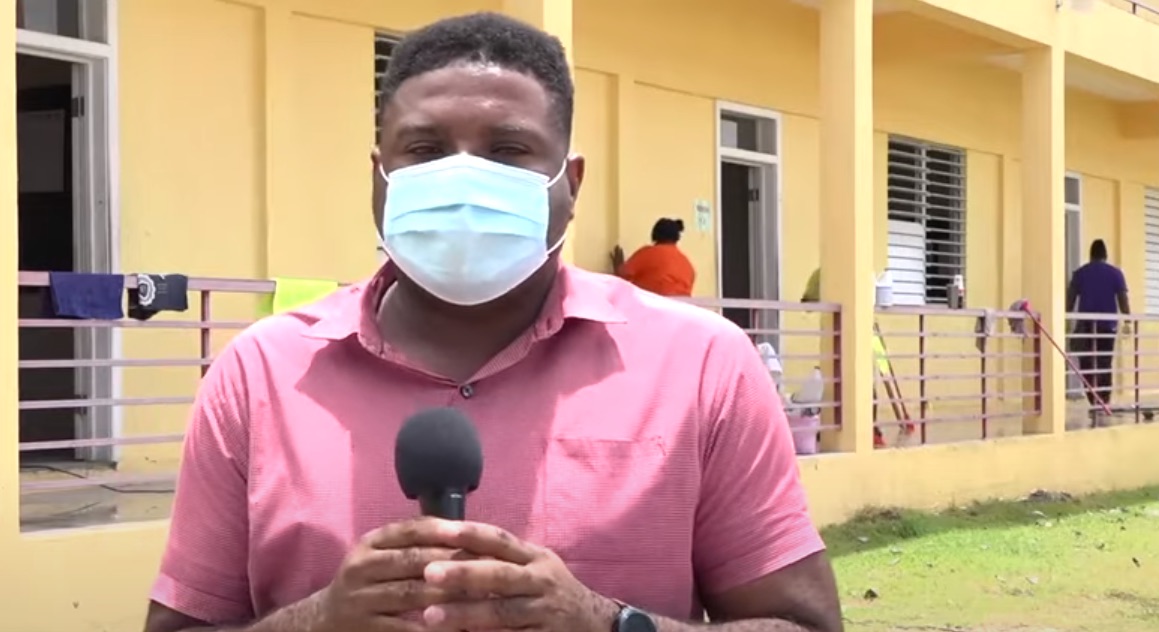 Hon. Troy Liburd, Junior Minister of Education in the Nevis Island Administration, takes a first-hand look at the deep cleaning and sanitizing of the Charlestown Secondary School on August 21, 2020