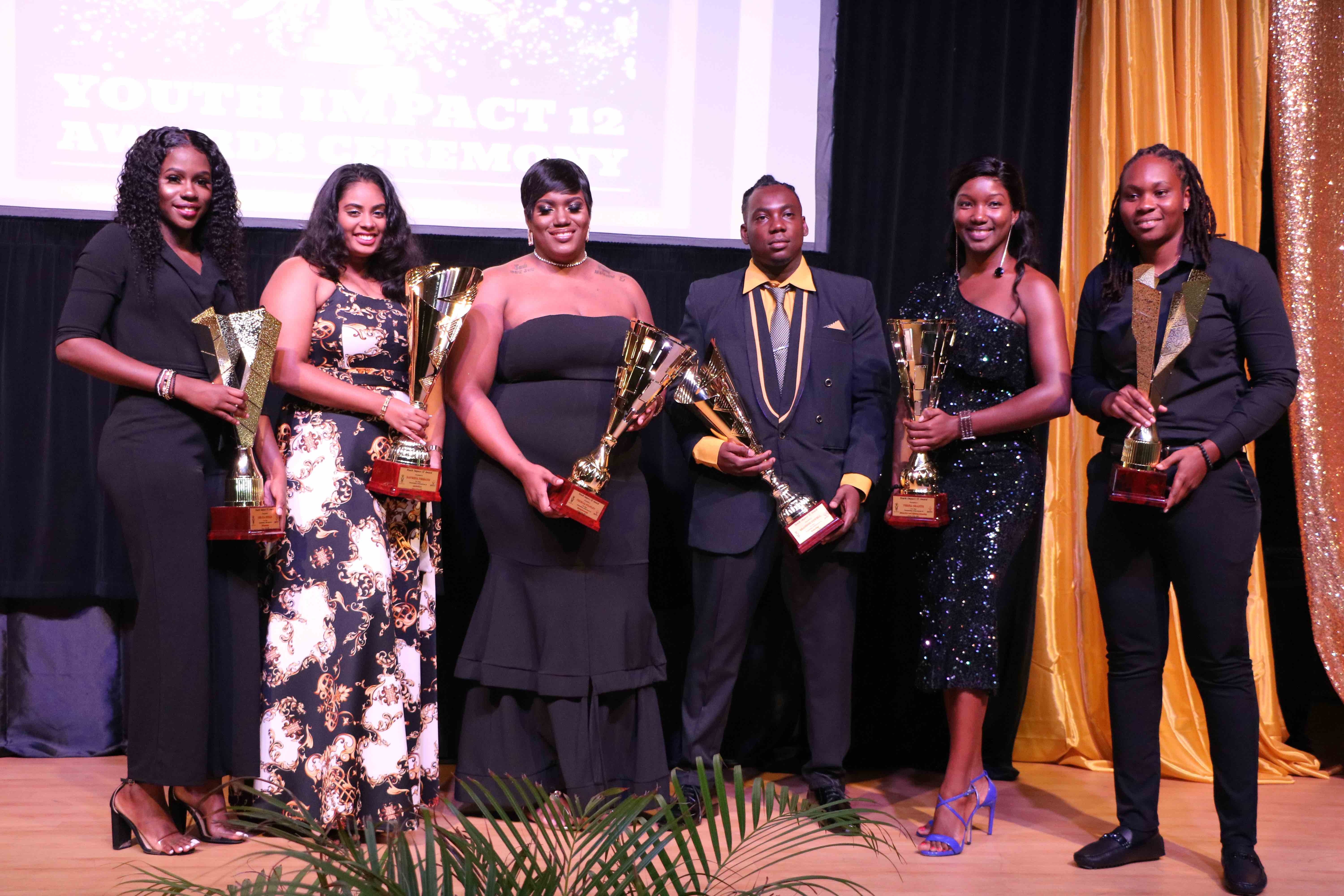 Six awardees at the Youth Impact 12 Awards Ceremony hosted by the Department of Youth on August 12, 2020, at the Nevis Performing Arts Centre (l-r) Delcia Burke awarded for Volunteerism; Raveena Persaud awarded for Extraordinary Youth in Agriculture; Cecelia Stanley awarded for Youth in Entrepreneurship; Brandon Powell awarded for Youth in Technology; Verna Grant awarded for Education and Life-long Learning; and Melicia Clarke awarded for Sports Excellence