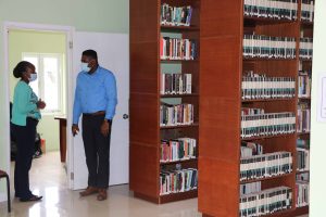 Mrs. Anatasia Parris-Morton, Librarian at the Nevis Public Library, gives Hon. Troy Liburd, Junior Minister of Library Services in the Nevis Island Administration a tour of the facility in the Slack’s building on Market Street in Charlestown on September 07, 2020  