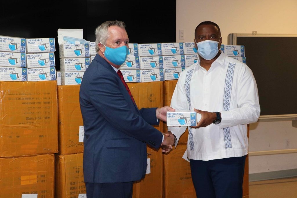 Premier of Nevis Hon. Mark Brantley, Senior Minister of Health in the Nevis Island Administration (r) accepting the donation of 100,000 disposable masks from Dr. Ralph Crum, Dean of the Medical University of the Americas at a handing over ceremony at the Emergency Operations Centre at Long Point on September 08, 2020