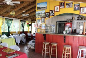 Inside Rodney’s Cuisine in Stoney Grove reflects the colours of the flag of St. Kitts and Nevis