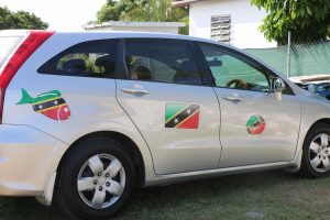 Rodney Elliott’s car with stickers reflecting the flag of St. Kitts and Nevis