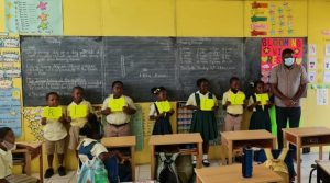 (Far right) Hon. Troy Liburd, Junior Minister of Education in the Nevis Island Administration treated to a presentation by Grade 2-2 students of the Ivor Walters Primary School, winners of the anti-bullying Virtues Project on October 09, 2020