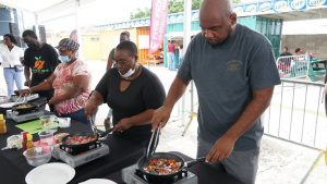(far right) Mr. Huey Sargeant, Permanent Secretary in the Nevis Ministry of Agriculture participates in a Master Chef class during World Food activities at the Cultural Village in Charlestown on October 17, 2020