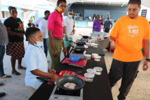 Patrons participate in a Master Chef class at  World Food Day activities at the Cultural Village in Charlestown on October 16, 2020