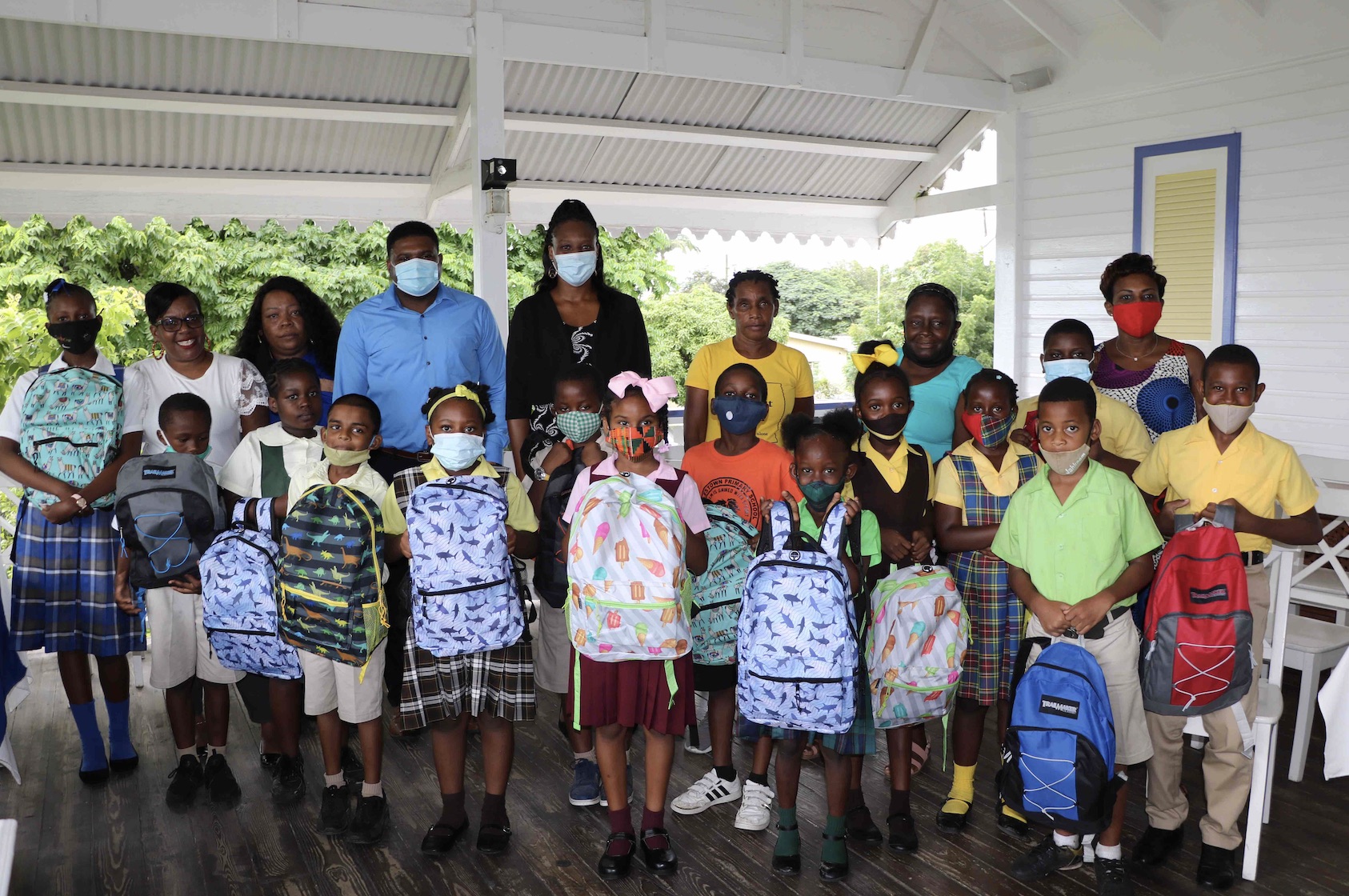 Members of the CCM Women’s Arm with Hon. Troy Liburd, Junior Minister of Education in the Nevis Island Administration, with recipients of school supplies donated by the CCM Women’s Arm on November 11, 2020