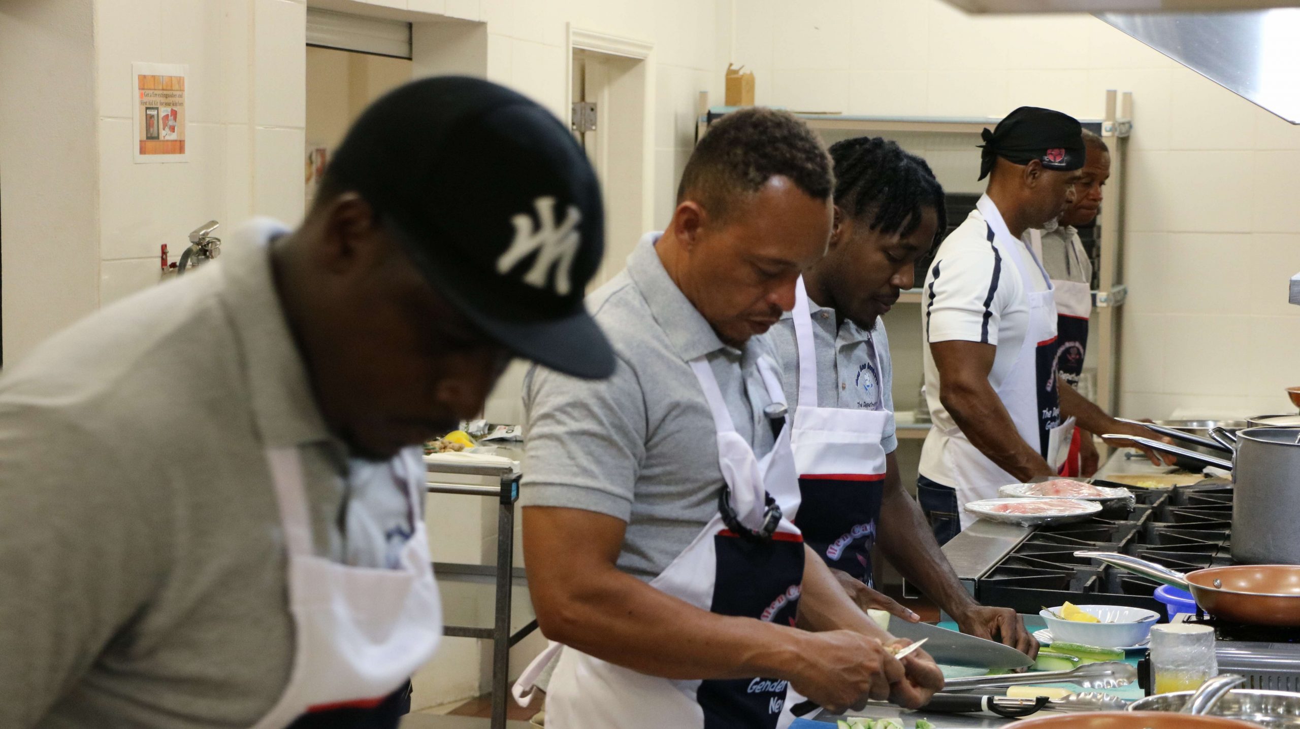 Participants in the Department of Gender Affair’s “Men Can Cook” programme during a session at the Charlestown Primary School’s Cafeteria on November 23, 2020