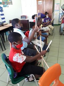 A section of the public primary school students from across Nevis learning the art of kite making on March 29, 2021, the first of a three-day Ministry of Education Kite Making Workshop at the Elizabeth Pemberton Primary School with sponsorship from the Hamilton Reserve Bank