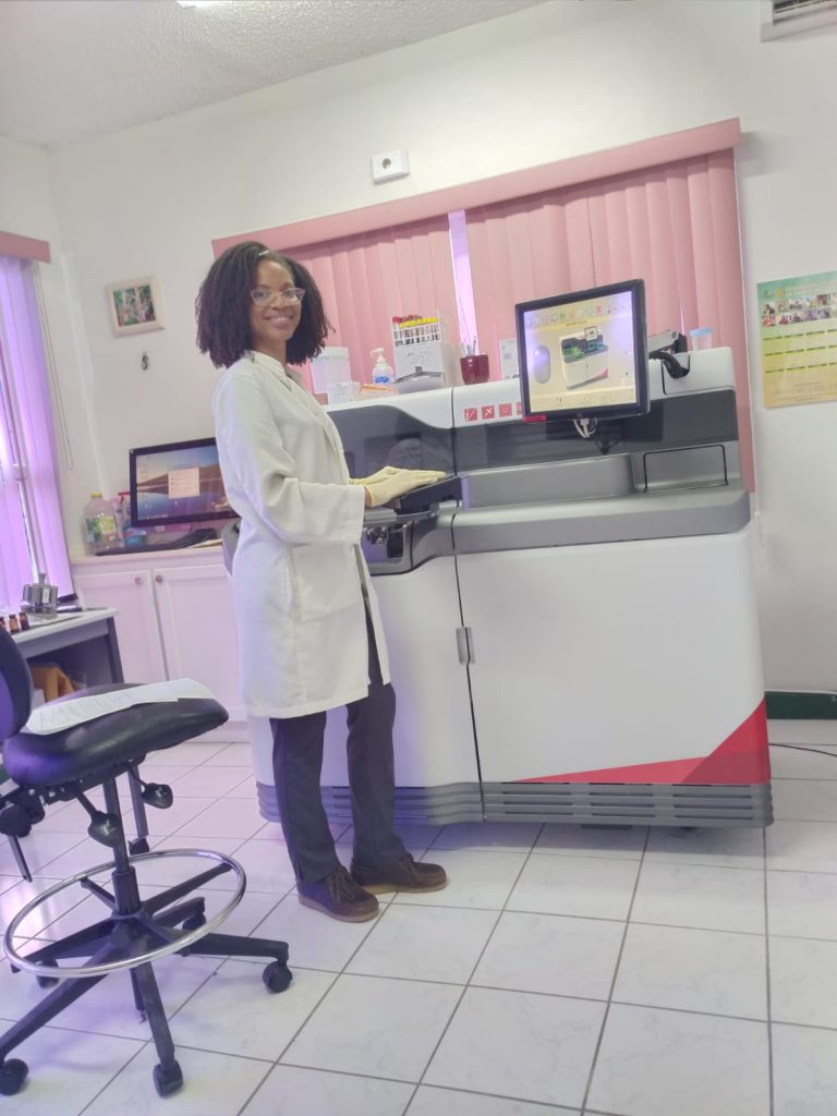 Ms. Julene Grant, Lab Technician at the Alexandra Hospital’s Lab on March 25, 2021, with the newly installed and commissioned VITROS XT 3400 chemistry analyzer