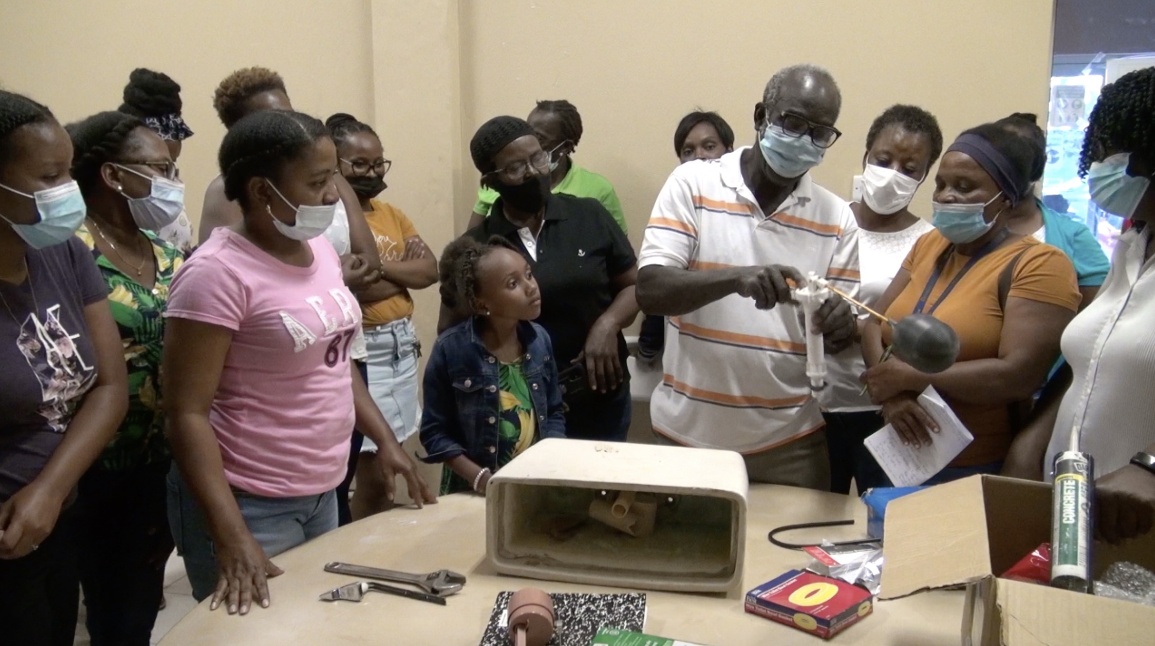 Participants at the Department of Gender Affairs’ Plumbing Workshop for Women at the Pond Hill Community Centre with facilitator Pastor Theophilus Kelly on March 30, 2021