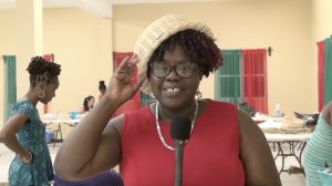 Hon. Hazel Brandy-Williams, Junior Minister of Health and Gender Affairs showing off a multi-use basket she wears as a hat on April 22, 2021, the work of a participant at the Department of Gender Affairs’ three-week Basket Weaving Workshop for women at the Pond Hill Community Centre 