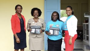 (L-r) Ms. Shelisa Martin-Clarke, Permanent Secretary in the Ministry of Health; Ms. Ermine Jeffers, Coordinator of Community Nursing Services; Mrs. Kenisha Sargeant, community health worker; and Ms. Latoya Jeffers, Assistant Secretary in the Ministry of Health on International Nurses Day, May 12, 2021 at the Charlestown Health Centre 
