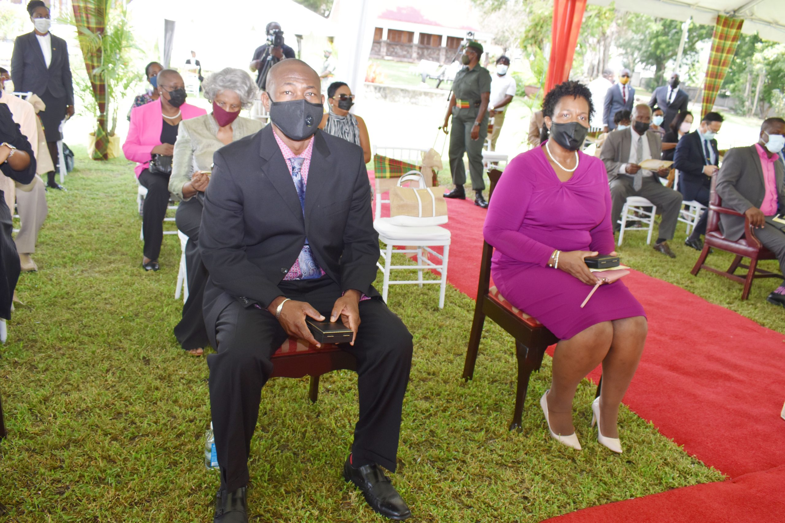 (l-r) Awardees from Nevis Mr. Brian Dyer and Dr. Judy Nisbett, Co-Chair and Chair respectively of the Nevis COVID-19 Task Force at the Investiture Ceremony at Government House in St. Kitts on August 17, 2021