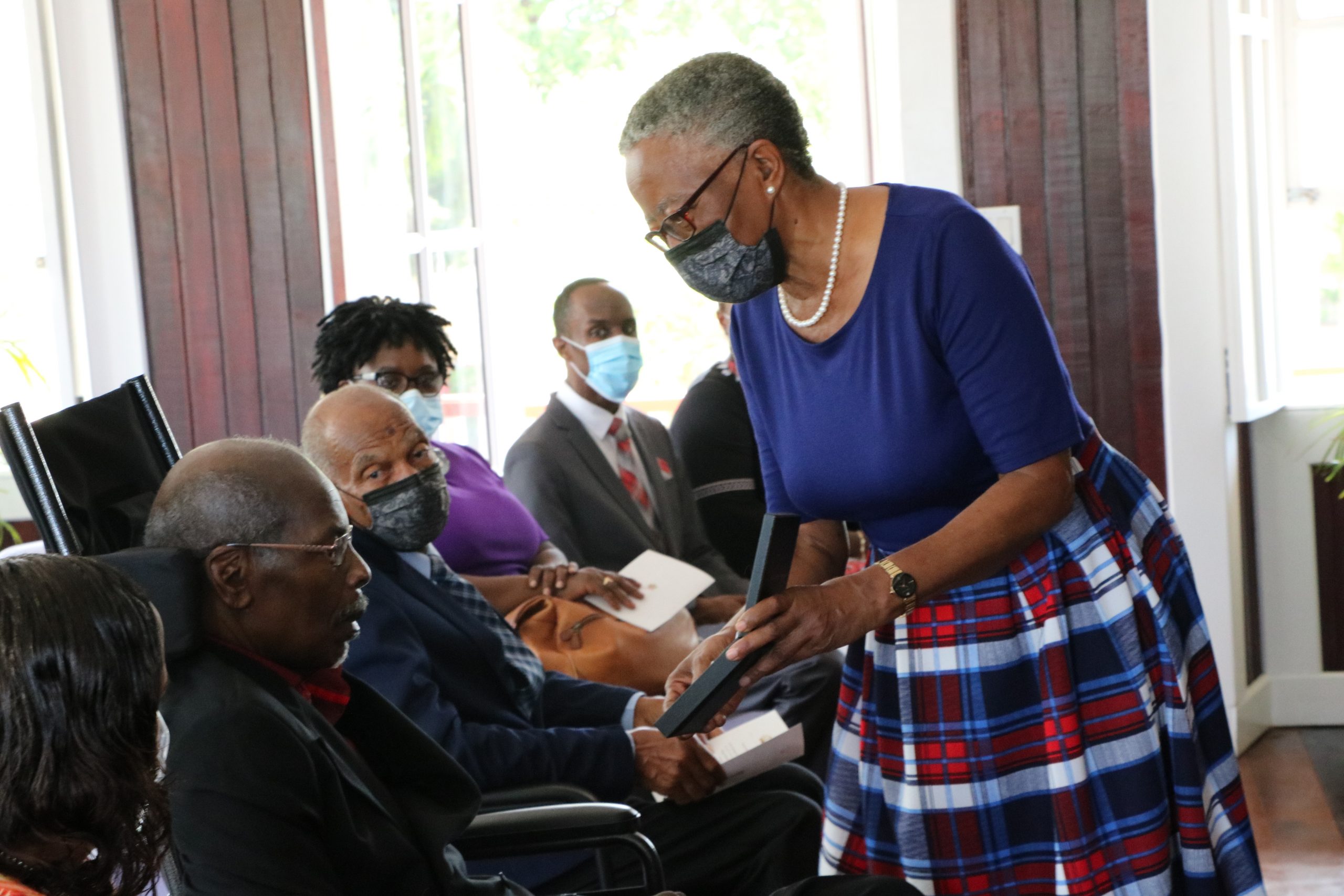 Her Honour Mrs. Hyleeta Liburd, Deputy Governor General on Nevis presents Dr. Albert Linton Liburd Sr. with the 2020 Medal of Honour for his outstanding contribution to National Service in the field of Medicine at an Investiture Ceremony at Government House at Bath Plain on September 09, 2021
