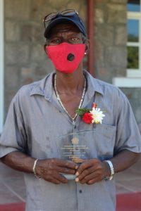 Mr. Austin Browne of Brown Hill showing off his award for his contribution to Sports following an Awards Ceremony at Government House on September 20, 2021 on the occasion of the 38th Anniversary of Independence of St. Christopher and Nevis 