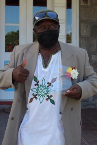 Mr. Eugene “Chevy” Chiverton with his Independence Day plaque for his contribution to Culture following an Awards Ceremony on September 20, 2021, at Government House on the occasion of the 38th Anniversary of Independence of St. Christopher and Nevis
