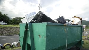A bin with white goods at the intersection of Shaws Road and the Island Main Road in Newcastle headed to the Long Point Landfill at a clean-up exercise spearheaded by Hon. Alexis Jeffers, Area Representative for St. James' Parish on October 16, 2021, in celebration of the 10th anniversary of his election to the Nevis Island Assembly