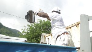 Hon. Alexis Jeffers, Area Representative for St. James’ Parish, loading up white goods in the parish during a clean-up exercise on October 16, 2021, in celebration of the 10th anniversary of his election to the Nevis Island Assembly