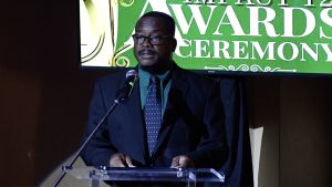 Mr. Keith Glasgow, Permanent Secretary in the Ministries of Social Development, and Youth and Sports delivering remarks at the Youth Impact 12 Awards Ceremony at the Nevis Performing Arts Centre on November 04, 2021