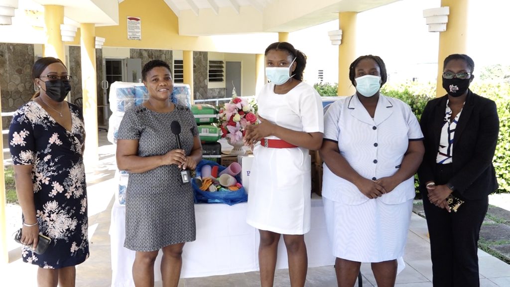 Members of the St. Kitts and Nevis Bar Association Ms. Shemica Maloney (left); Ms. Anmarieta Staines (second from left); and Ms. Janicia Hodge (extreme right) with Registered nurse Kella Didier (third from left) and nursing assistant Cecilia Stanley during a presentation at the Flamboyant Nursing Home on November 22, 2021, in observance of Law Week 2021