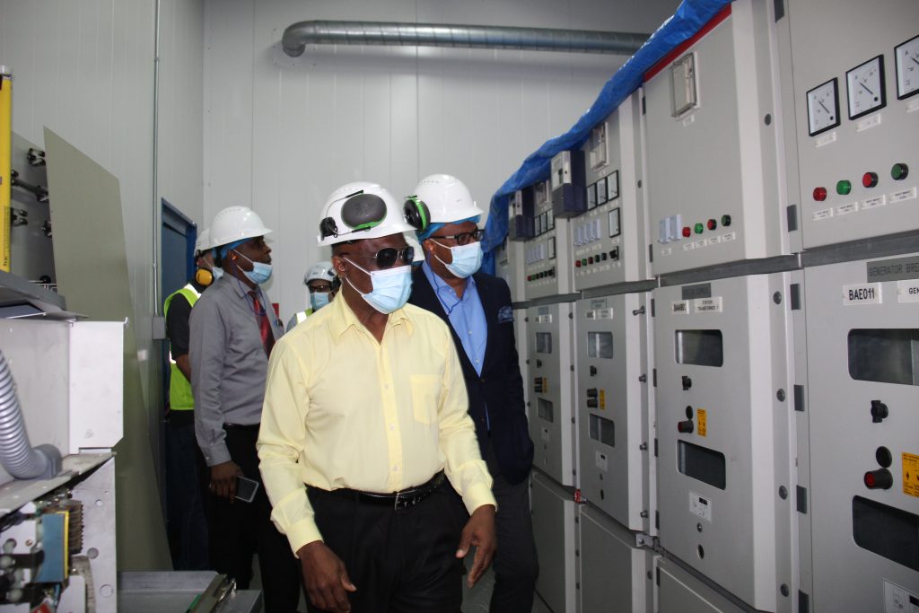 Hon. Mark Brantley, Premier of Nevis and Minister of Public Utilities and Energy (second) and other members of the Nevis Island Administration Cabinet on a tour of the Nevis Electricity Company Limited’s Power Plant at Prospect on December 02, 2021, led by Mr. Earl Springett, Generation Manager and Project Manager