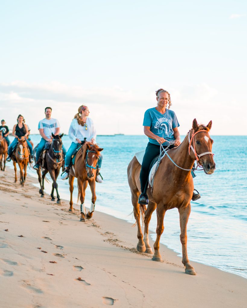 Visitors to Nevis horseback riding on the beach along the water’s edge (photo provided)