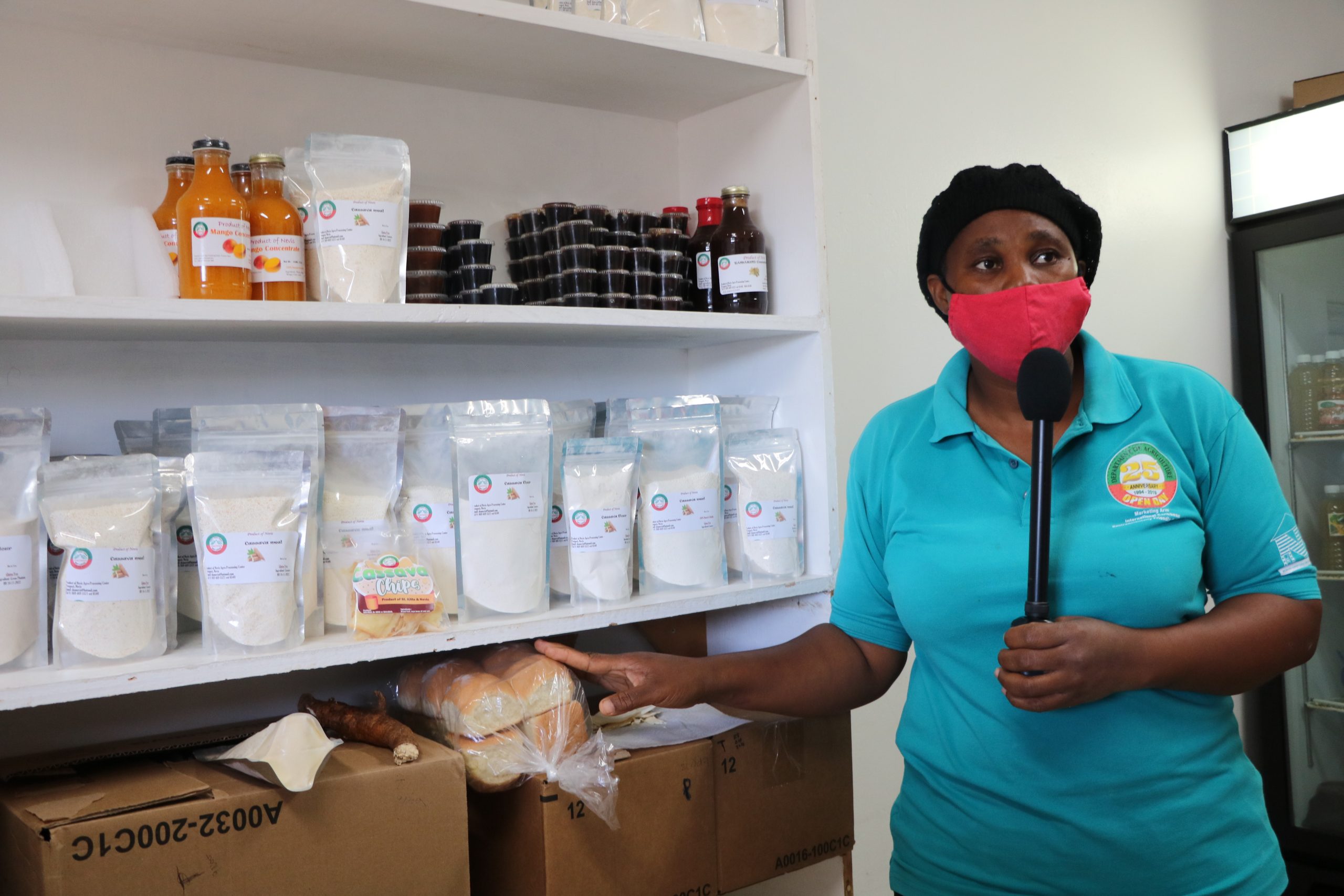 Mrs. Shermel England, Manager of the Nevis Agro Processing Centre at Prospect showing some products made there