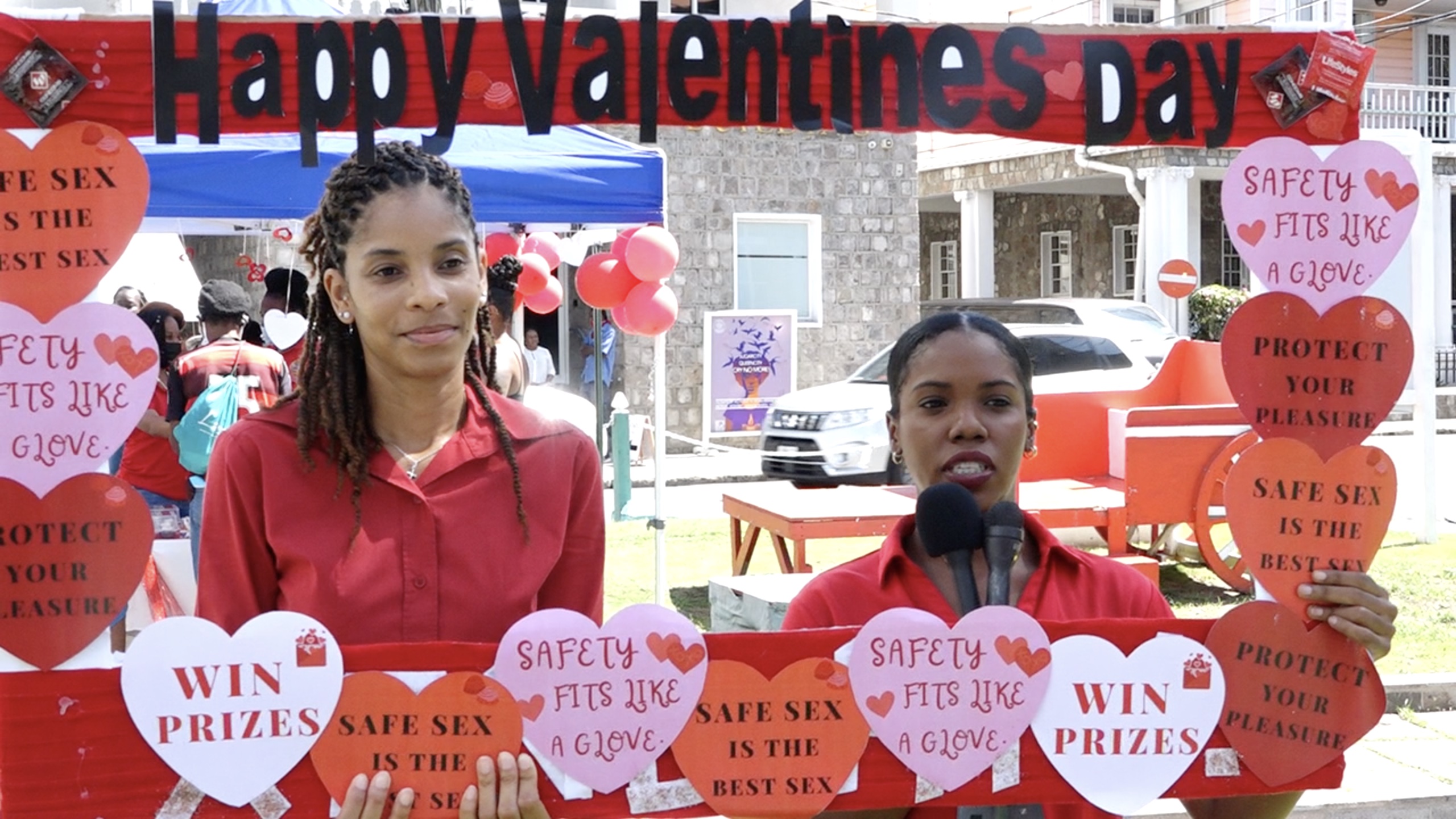 (L-r) Mrs. Nadine Carty-Caines, HIV/AIDS Programme Coordinator; and Ms. Oceana Oloughlin, Health Educator both of the Nevis Health Promotion Unit at the War Memorial in Charlestown at their Valentines’ Day safe sex promotion on February 14, 2022