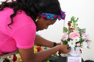 A florist showing off her skills at the Department of Gender Affairs’ Gender Expo ‘22 at the Malcolm Guishard Recreational Park on March 18, 2022