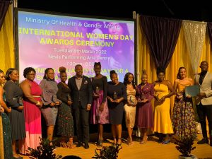Hon. Mark Brantley Premier of Nevis and Minister of Health and Gender Affairs (8th from right) and Hon. Hazel Brandy Williams, Junior Minister (3rd from left) with awardees at the Ministry of Health and Gender Affairs’ International Women’s Day Awards Ceremony at the Nevis Performing Arts Centre on March 08, 2022