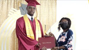 Mr. Zyte Bodley, Valedictorian of the Nevis Sixth Form College Graduating Class of 2021 accepting his Diploma of Graduation from Mrs. Majorie Brandy at the graduation ceremony on March 02, 2022, at the Nevis Cultural Village