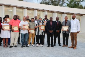Hon. Alexis Jeffers, Minister of Agriculture (fourth from right); Mr. Randy Elliott, Director of the Department of Agriculture (third from right); Hon Eric Evelyn, Minister of Social Development (second from right); and Mr. Huey Sargeant, Permanent Secretary in the Ministry of Agriculture (extreme right) with the ministry’s honourees for 2021 at an awards and dinner event at the Malcolm Guishard Recreational Centre on May 29, 2022